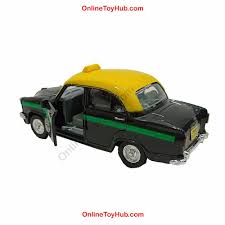 Toy taxi with yellow top and black body on a white background