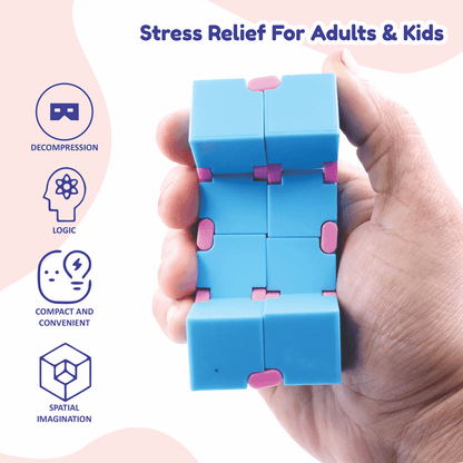 Hand holding a blue and pink Infinity Cube fidget toy for stress relief and brain logic