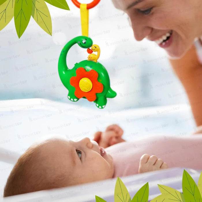 Green musical gourd rattle with dinosaur design for infants, stimulating sound and play