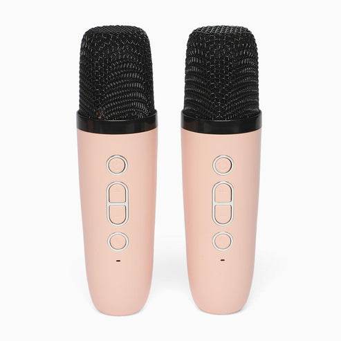 Pair of pink karaoke speakers with microphone feature for home entertainment