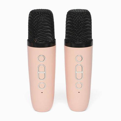 Pair of pink karaoke speakers with microphone feature for home entertainment