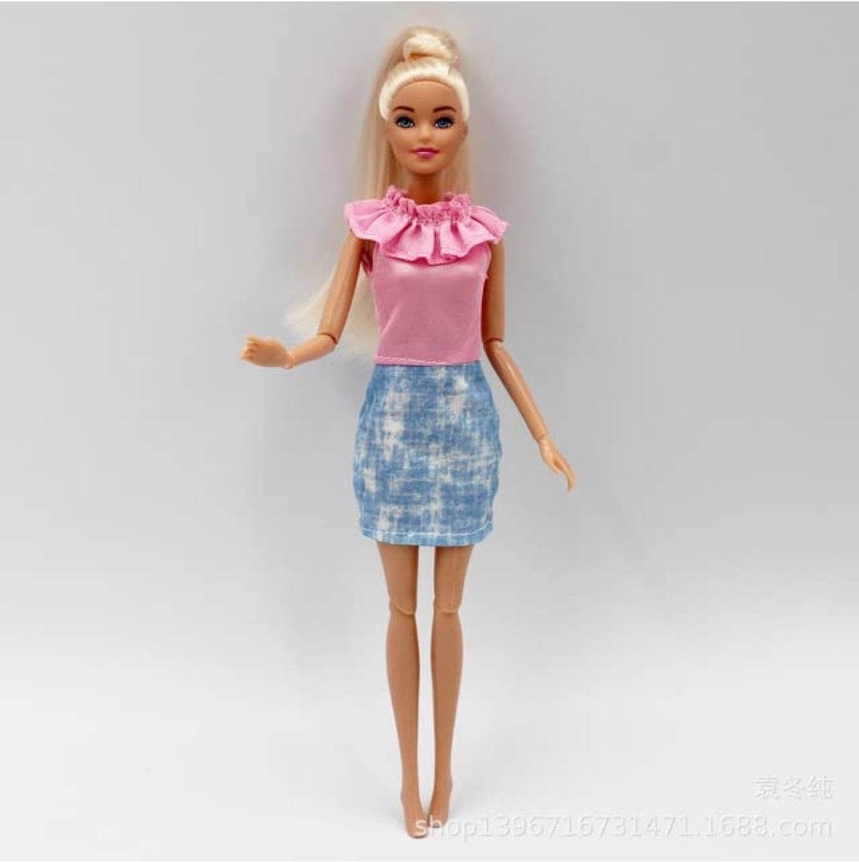 Kiara fashion doll for kids with blonde hair wearing pink top and blue skirt