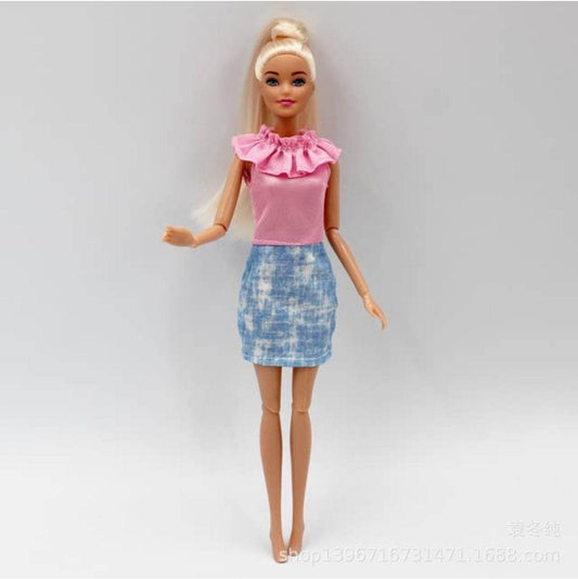Kiara fashion doll for kids with blonde hair wearing pink top and blue skirt