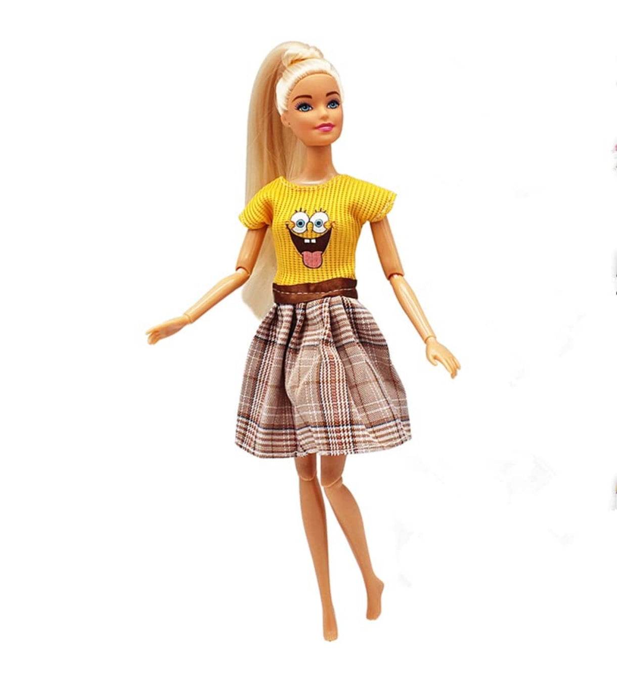 Kiara fashion doll for kids wearing yellow top with cartoon print and plaid skirt