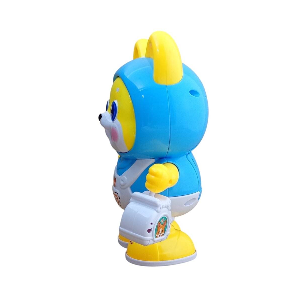 T-REX battery operated dancing dog toy in blue and yellow holding a white bag