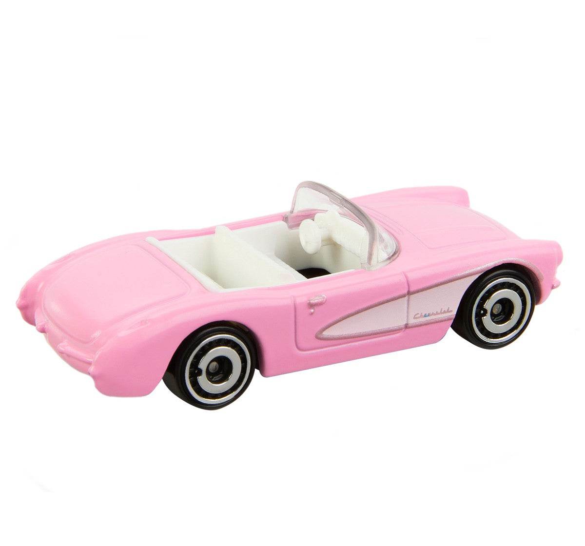 Pink Barbie Hot Wheels die-cast car with white interior and black wheels toy collectible