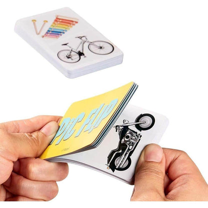 Hands holding and flipping cards from Pic Flip card game for kids featuring colorful images like a motorcycle and bicycle