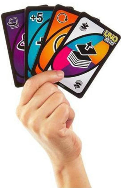 Hand holding UNO Flip card game for kids showing colorful action and number cards