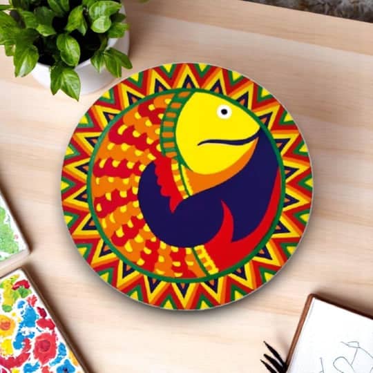 Colorful round platter featuring mithila painting madhubani design with fish motif