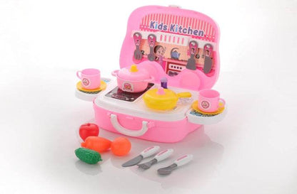 Pink modular kitchen toy set for kids with pots, pans, cups, utensils, and plastic vegetables