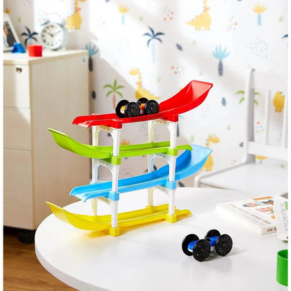 Colorful ramp race track toy for kids with four levels and small black race cars on a white table