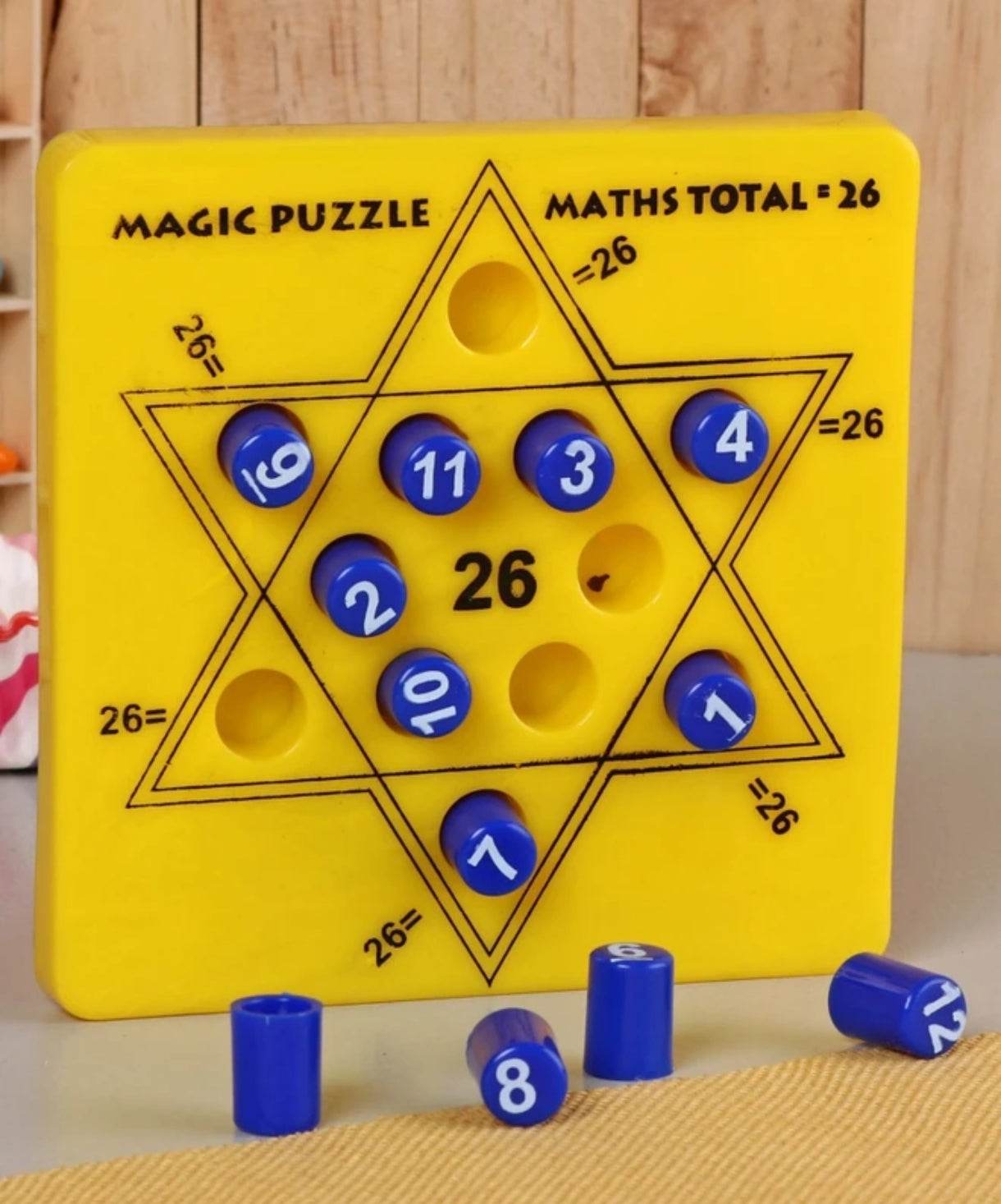 Yellow kids math puzzle toy with blue numbered pegs and magic puzzle star design