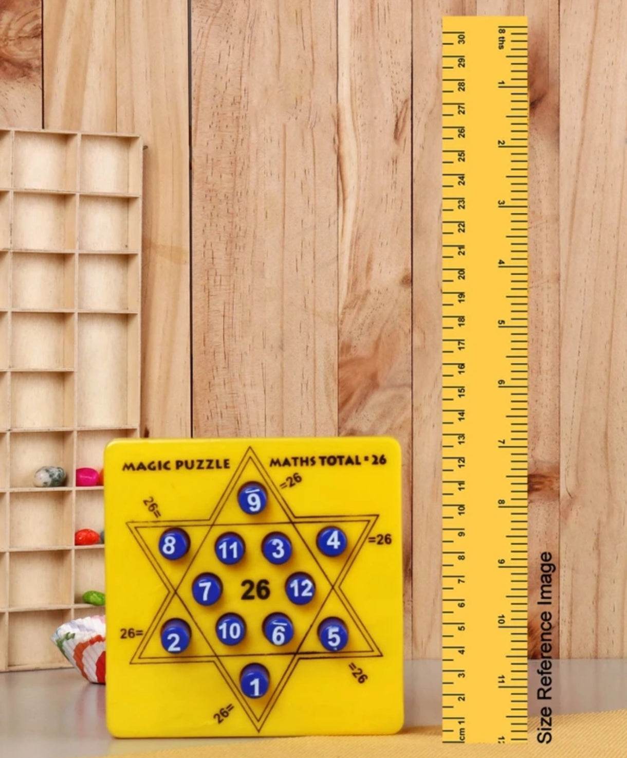 Yellow kids math puzzle toy with numbered star shape and total 26 displayed beside yellow ruler