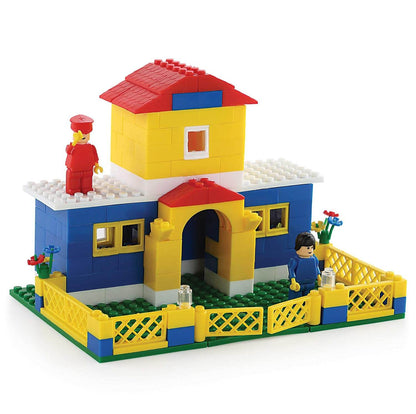 Junior architect building blocks colorful house model with two figurines and yellow fenced yard