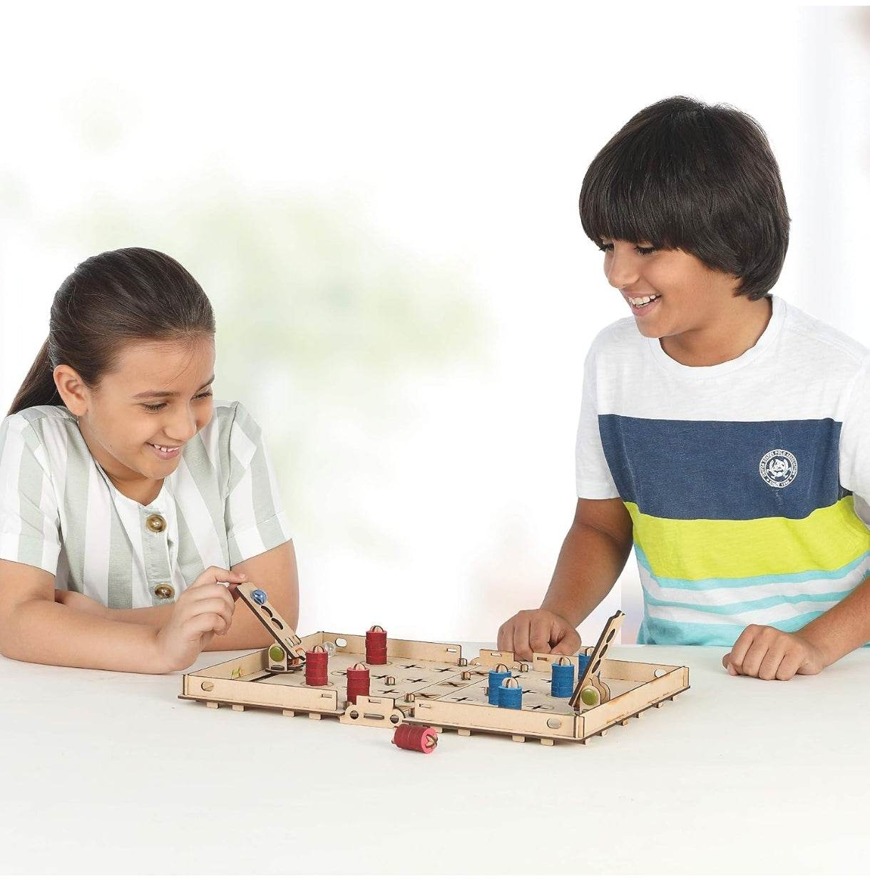 Two children playing with Smartivity Chess Attack construction kit wooden game board with movable pieces