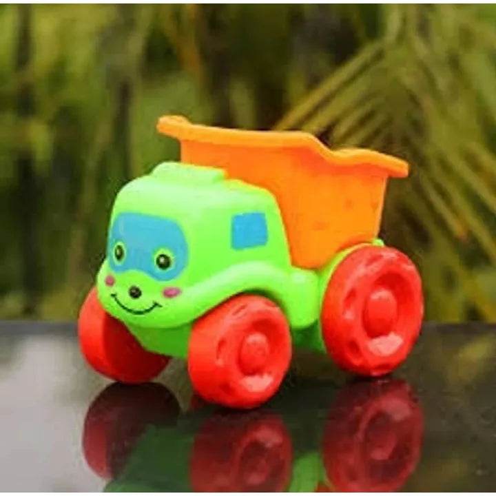 Colorful rattling dumper toy truck with smiling face and bright red wheels for toddlers