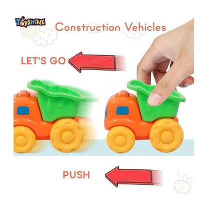 Rattling dumper toy truck in orange and green pushed by hand demonstrating construction vehicle play
