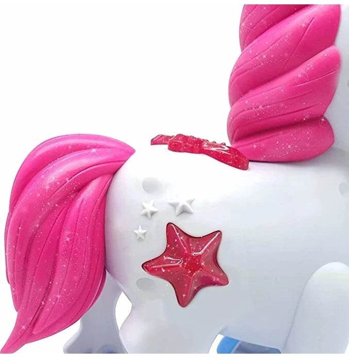 White unicorn toy with pink mane and sparkly decorations for imaginative play