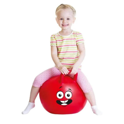 Child playing with a red rubber kangaroo hopping ball for kids with a smiling face design